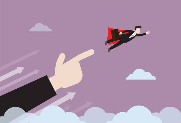 istock Businessman with a red cape flies with a helping hand 1221125944