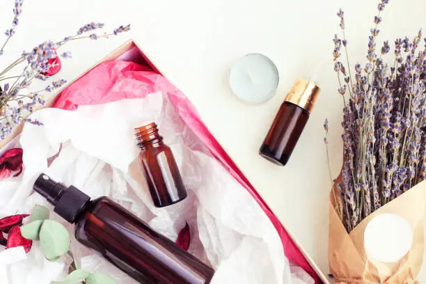 Facial serum, herbal body lotion, essential oils spa kit.
