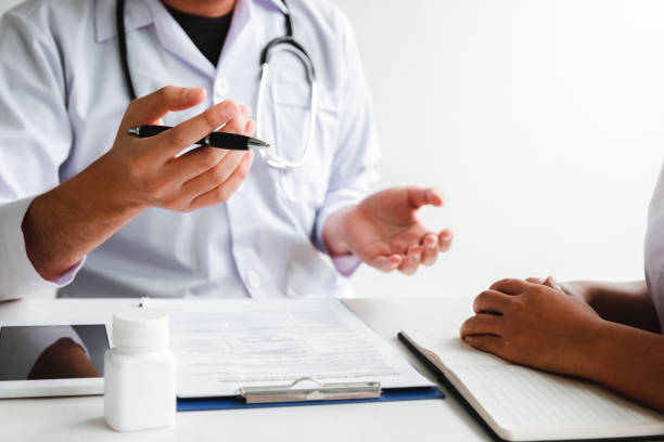 istock Doctors and patients Consulting about Treatment guidelines at office 1221130572
