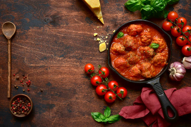 istock Meat balls in tomato sauce in a skillet 1221131742