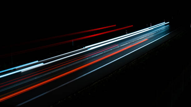 istock lights of cars with night 1221132184