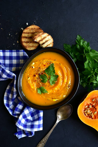 istock Hot spicy autumn pumpkin soup 1221133011