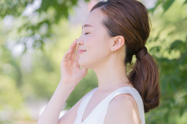 istock Asian young woman surrounded by greenery 1221133117