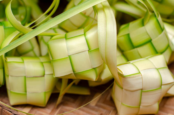 istock ketupat casing and rice in bamboo container 1221133399