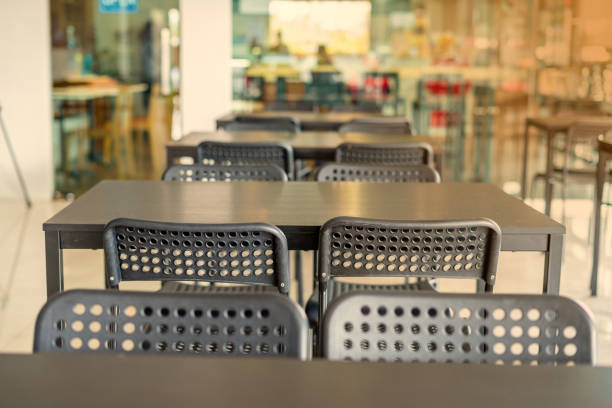 istock Black chairs that have in common Pattern Arranged in a form in front of the coffee shop and Light from the sun 1221135384