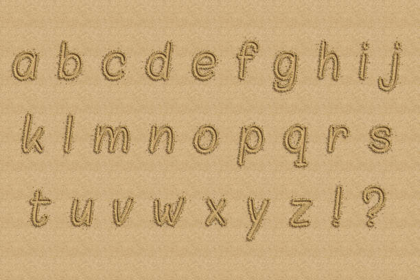 istock The alphabet written in sand on a beach. 1221138298
