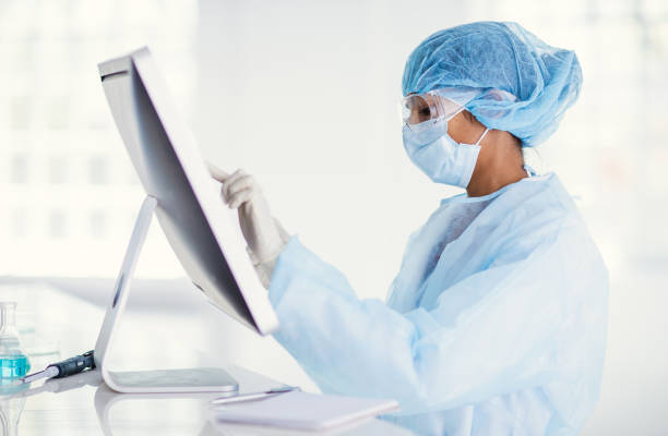 istock Scientist wearing full protective suit working in the laboratory 1221140135