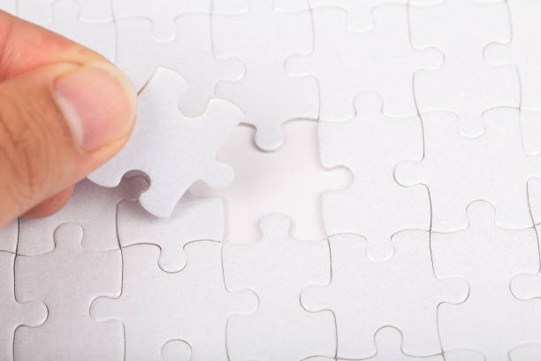istock The last piece of white jigsaw puzzle. 1221140347