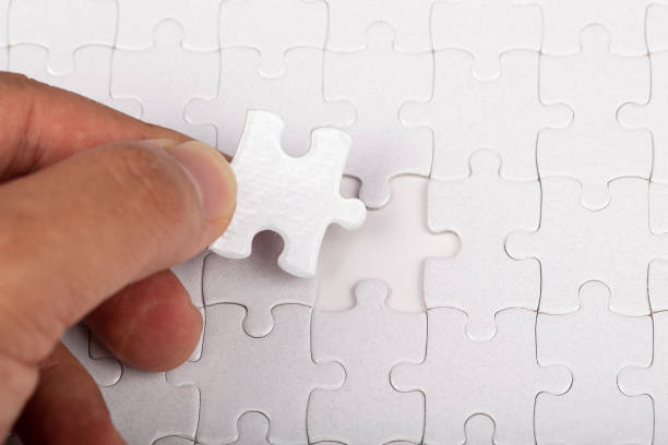 istock The last piece of white jigsaw puzzle. 1221140403
