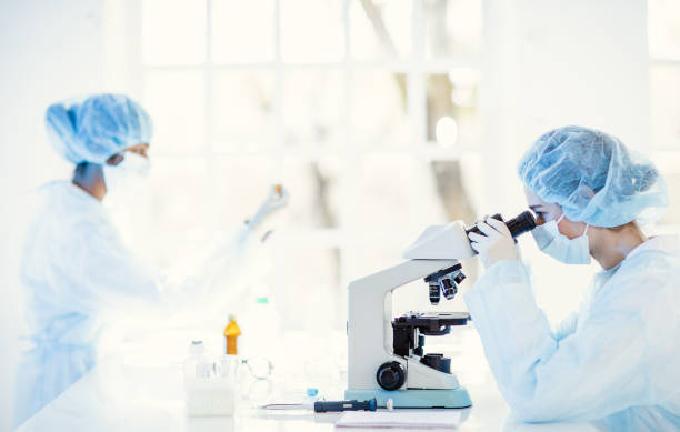 istock Scientists wearing full protective suit working in the laboratory 1221140431