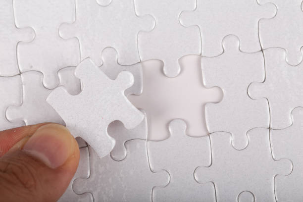 istock The last piece of white jigsaw puzzle. 1221140497