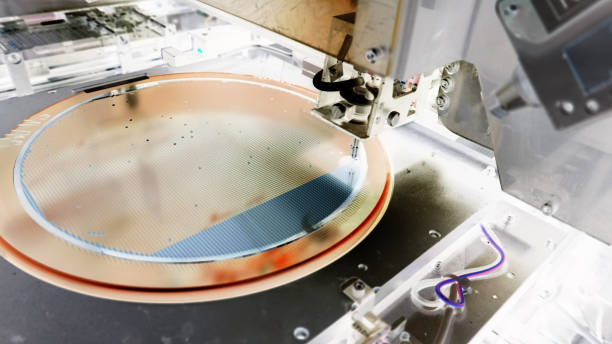 istock Silicon wafer negative color in machine in semiconductor manufacturing 1221143060