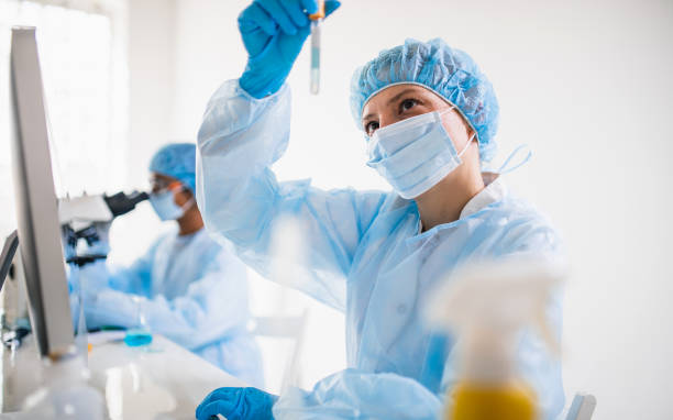 istock Scientists wearing full protective suit working in the laboratory 1221143064