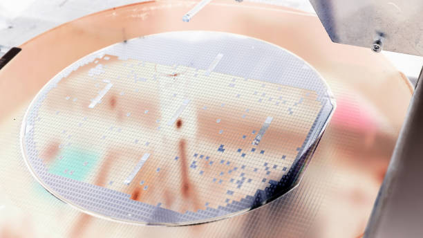 istock Silicon wafer negative color in machine in semiconductor manufacturing 1221143085