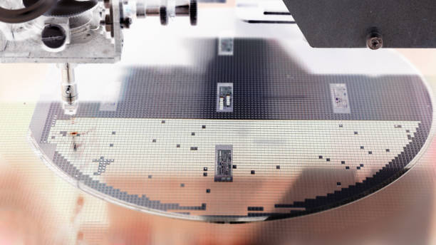 istock Silicon wafer negative color in machine in semiconductor manufacturing 1221143097
