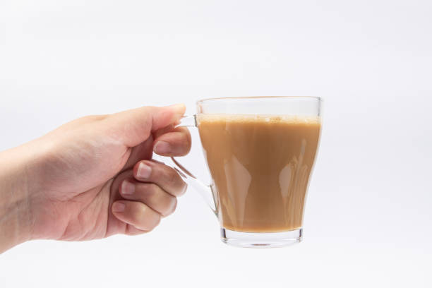 istock Man hand with A glass of Coffee on White Background. 1221143254