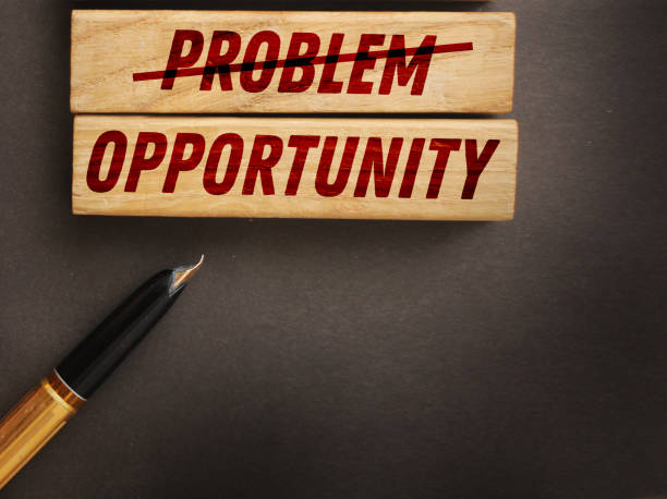 istock Problems crossed out and opportunity on wooden blocks. Business startup concept 1221143877