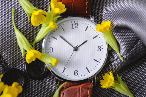 istock Watch with small yellow flowers 1221147790
