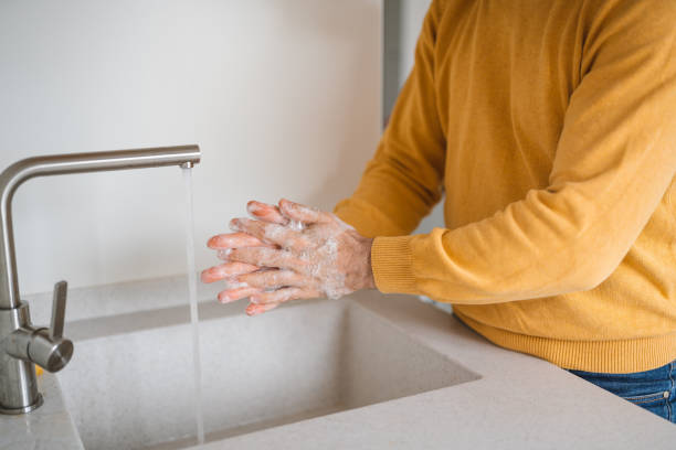 istock Coronavirus prevention. Man wash our hands with antibacterial soap. 1221147979