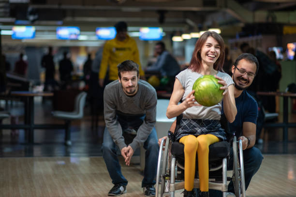 Disabled woman in a wheelchair bowling