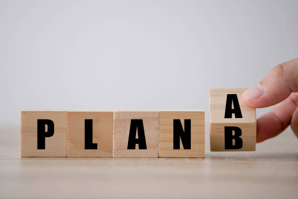 Hand flipping wooden blocks for change plan 