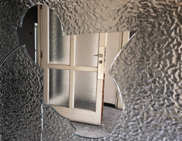 istock a broken glass from a door 1221151478