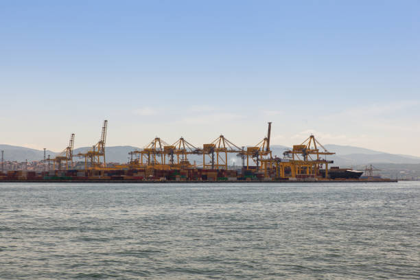 istock Industrial Container Cargo freight ship with working crane bridge in shipyard 1221151673