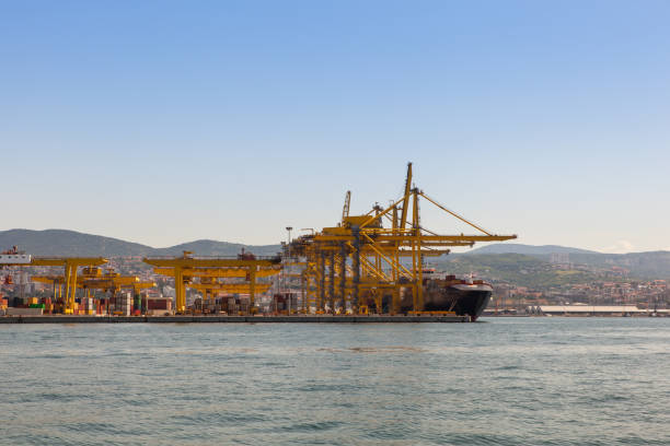 istock Industrial Container Cargo freight ship with working crane bridge in shipyard 1221151675