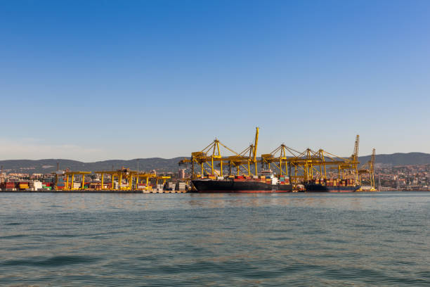 istock Industrial Container Cargo freight ship with working crane bridge in shipyard 1221151679
