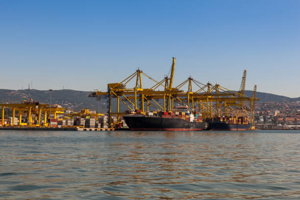 istock Industrial Container Cargo freight ship with working crane bridge in shipyard 1221151692