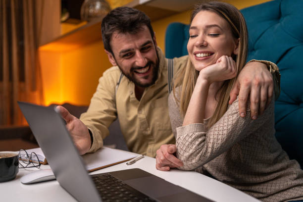 istock Smiling couple relaxing in a pause of work 1221153477