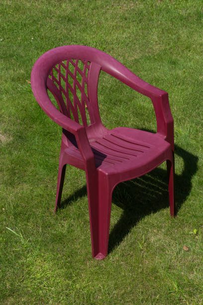 istock plastic chair on the grass. no one. the quarantine continues 1221153479