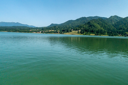 Beautiful view of Colibita Lake - Bistrita Nasaud County, Romania; summer sunny day