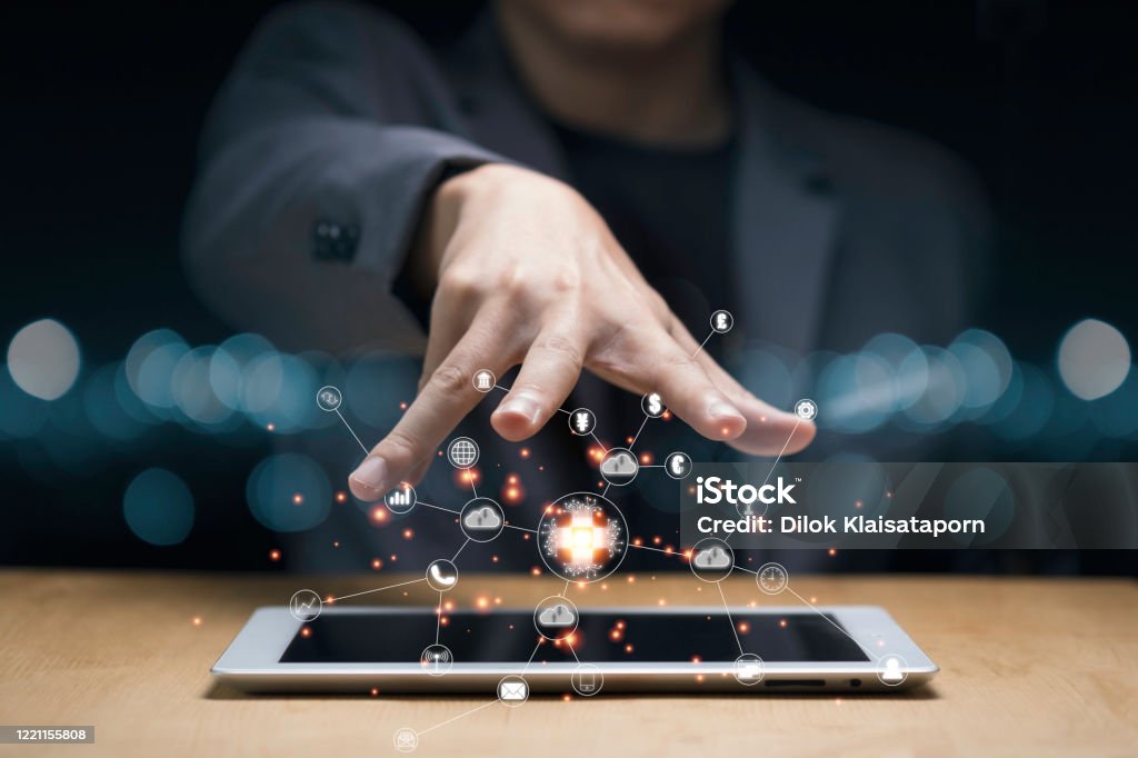 Businessman hand create artificial intelligence for technology transformation and internet of thing on tablet. Cloud technology will management big data include business strategy , customer service. Technology Stock Photo