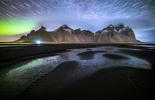 Vestrahorn mountain with Aurora borealis and startrails, Stokksnes, Iceland