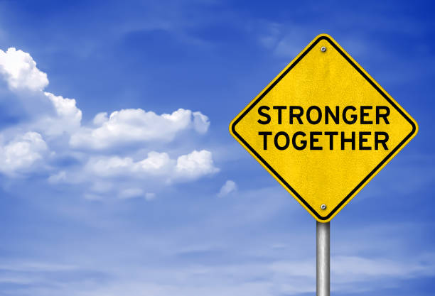 istock Stronger Together roadsign infomation 1221156083