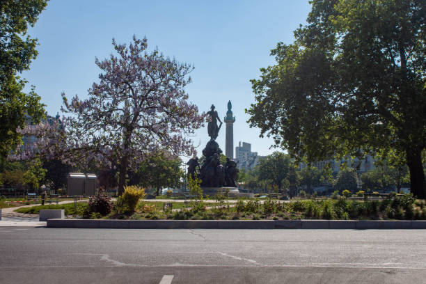 France imposed a nationwide lockdown to control the spread of COVID-19. This is a picture of Paris during the lockdown. Located place de la Nation during a beatifull spring sunny day, with blue sky.