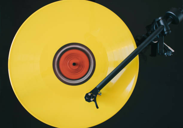 istock Turntable play yellow vinyl record 1221160618