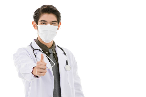 istock Young Asian man in lab coat in white background 1221161145