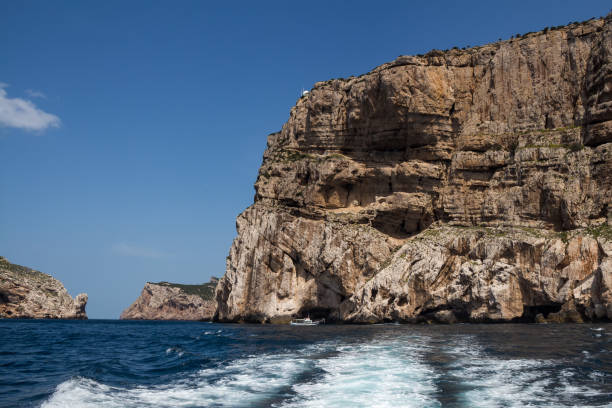 istock Cliffs and island Isola Foradada, Sardinia 1221162358