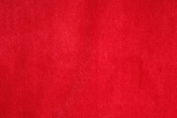 Red Velvet Fabric Texture Close shot to red velvet fabric for tiling texture red velvet material stock pictures, royalty-free photos & images