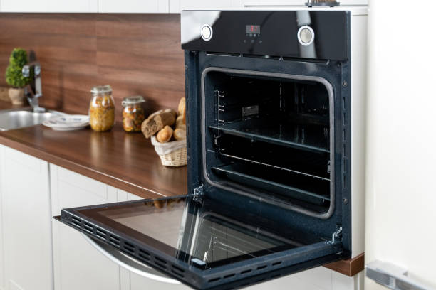 open oven on white rustic kitchen - oven imagens e fotografias de stock