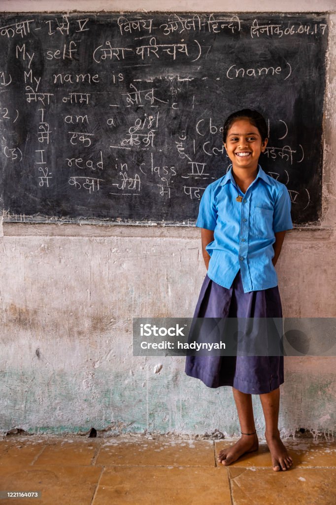 Indian schoolgirl in classroom Indian schoolgirl in classroom, English language class, Rajasthan, India India Stock Photo