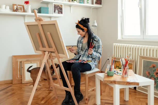 istock Female Artist with her Dog 1221166839