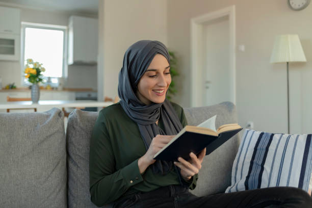 istock Muslim Girl With Hijab Reading a Book 1221166993