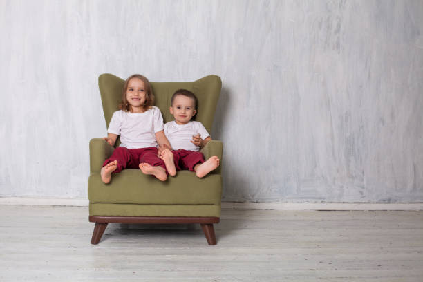 istock Boy and girl sit together and hold hands 1221167963