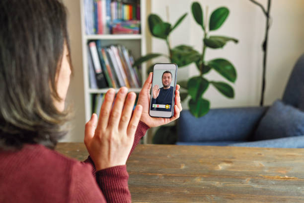 istock Happy family talking within video call on smart phone for social distancing. 1221168431