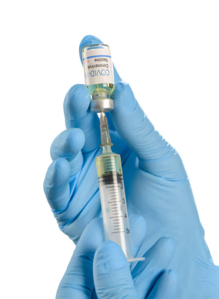 istock Doctor preparing vaccination for coronavirus COVID 19 isolated on white background. 1221170214