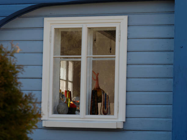 istock Original wooden blue house with renovated wall 1221170906