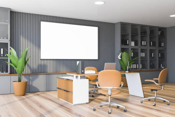 istock Gray CEO office corner with bookcase and poster 1221172333